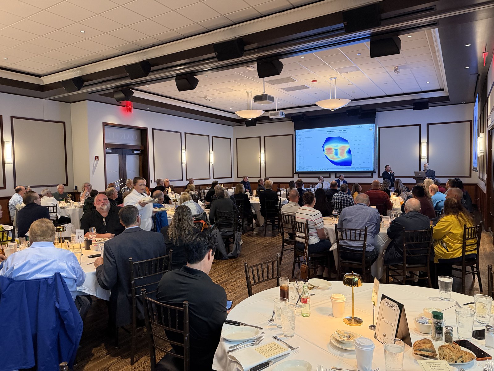 A full room of accredited investors at The Oil & Gas Tax Summit at Gibsons Bar & Steakhouse